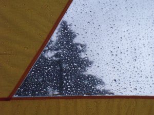 A view of the rain falling from inside the tent